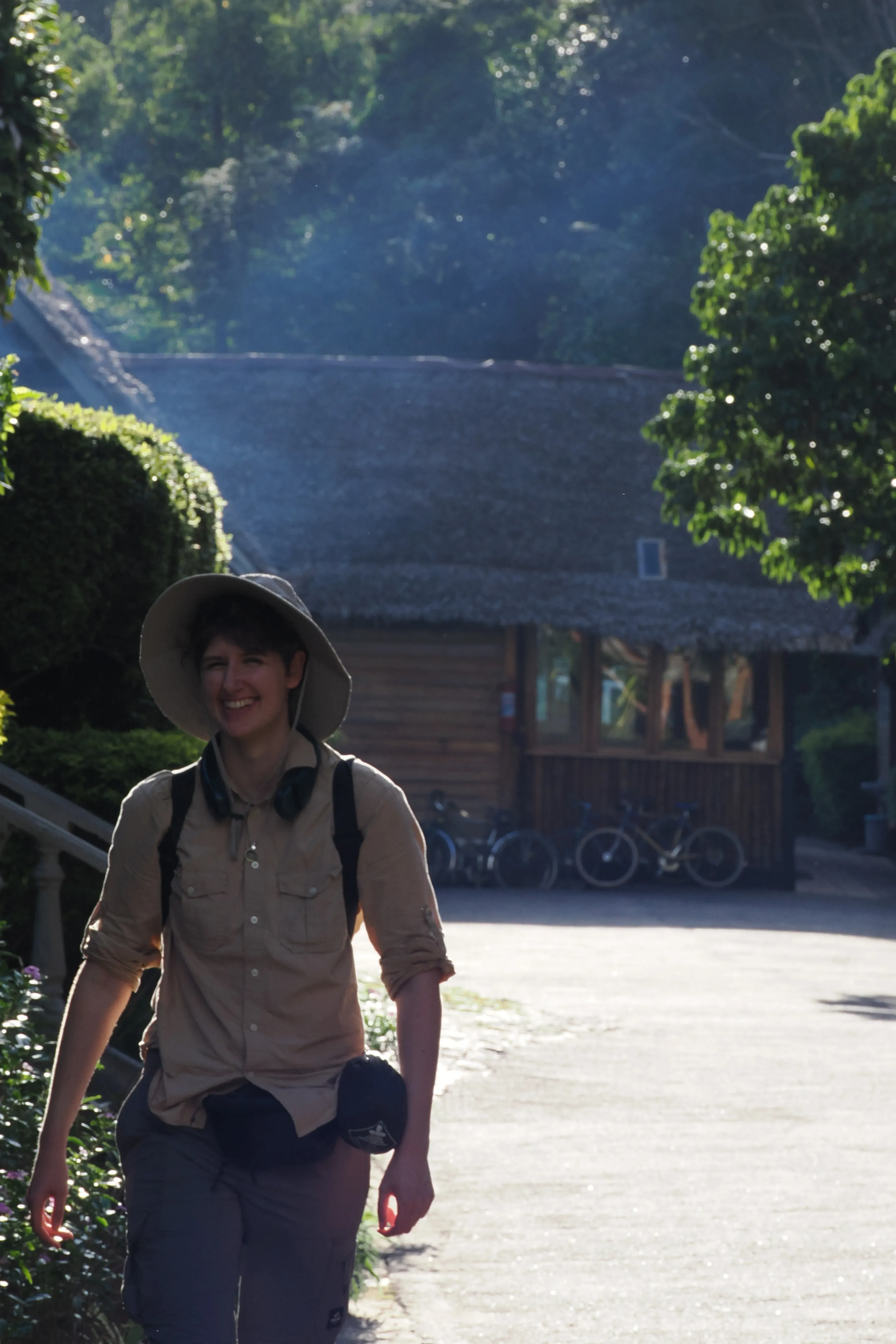 A person wearing a hat walking 