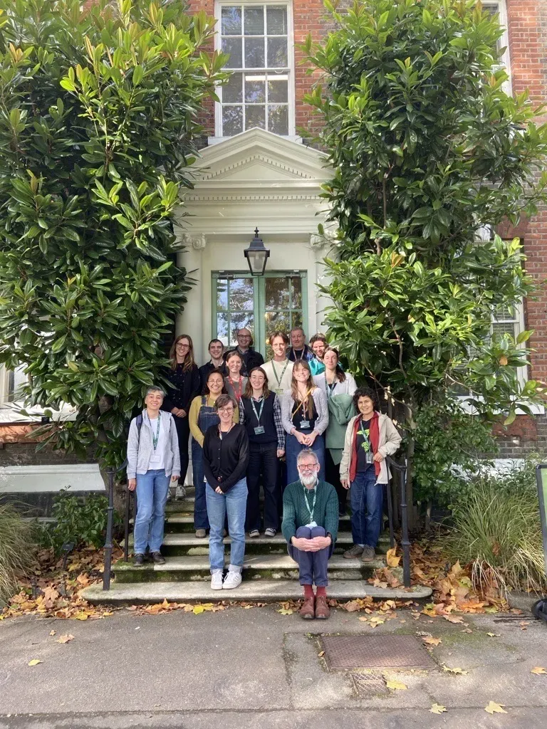 A team photo of Herbarium staff, taken on the steps outside Kew’s Hunter House at the entrance to the herbarium. 