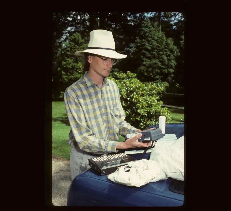 A Kew scientist using early 90s scientific equipment at Wakehurst