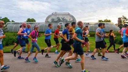 Runners going past the Palm House